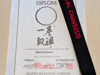 Bild 2: Passend zum Dan-Diplom erhielt Belal einen neuen Schwarzgurt mit Namensbestickung.